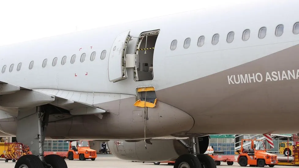 _129874295_airplanedoor.jpg.webp